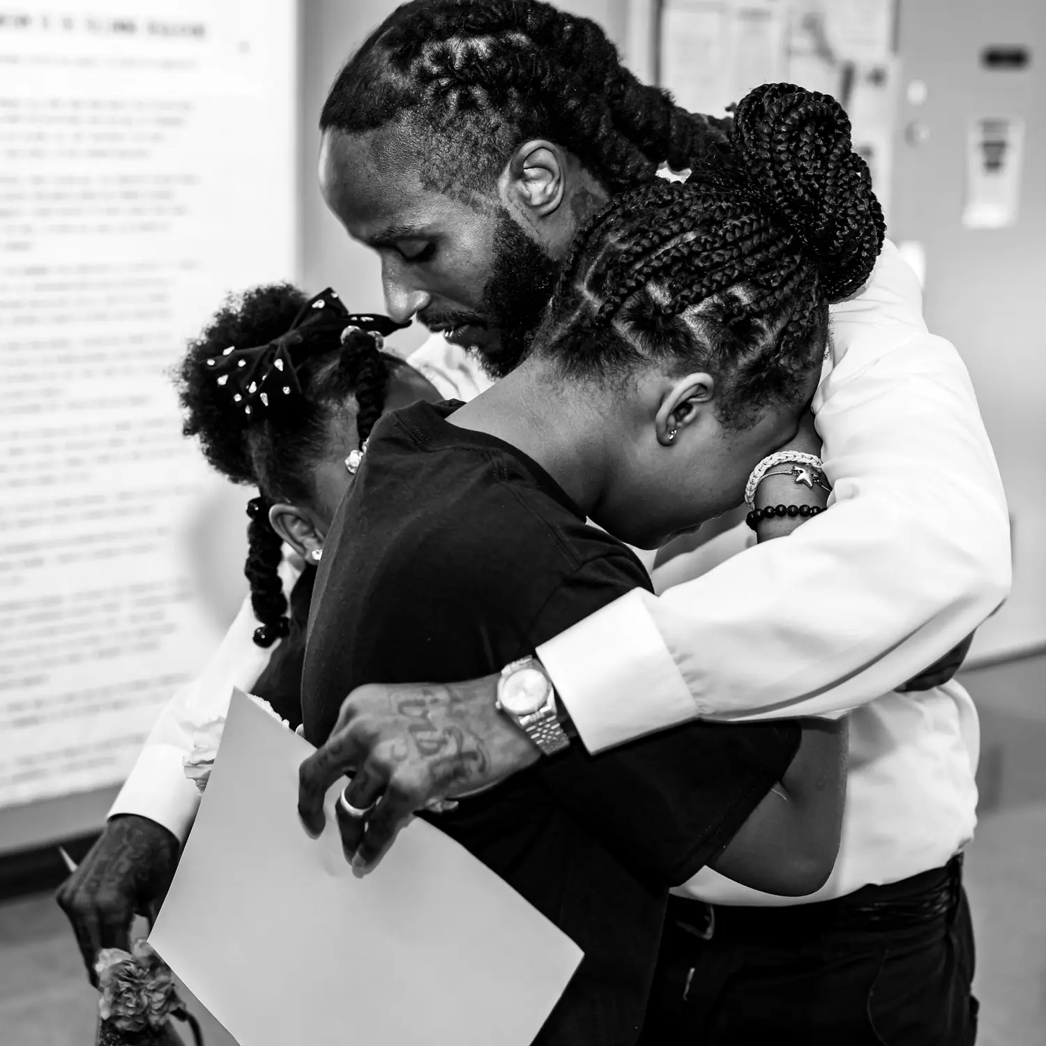 A father embraces his daughter at The Four-Seven's Daughters Dance.