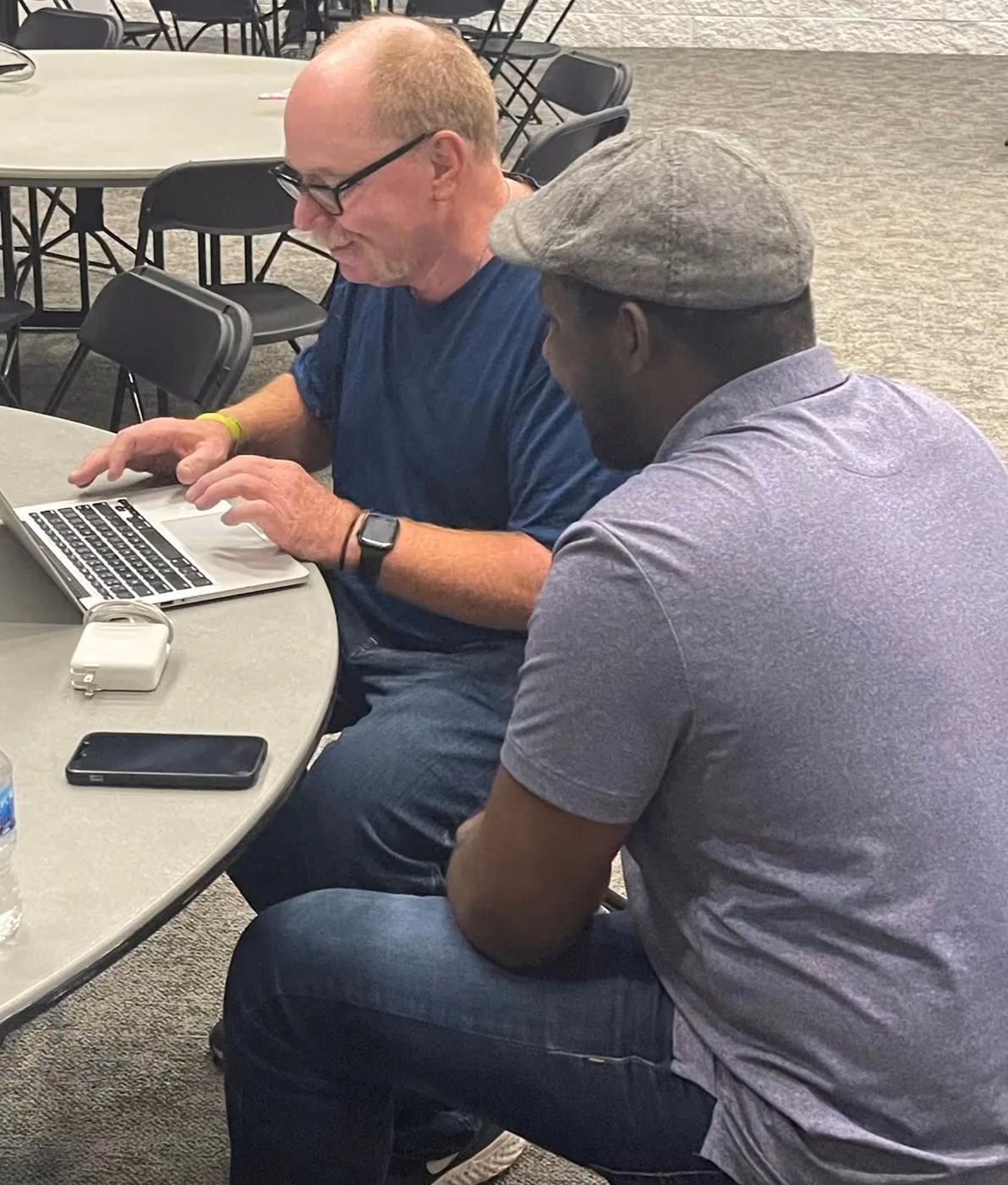 Four-Seven participants working together at a table.